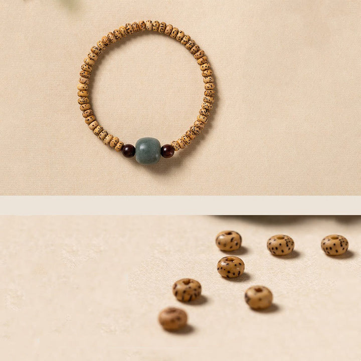 Buddha Stones Armband van Bodhizaad, kleine blaadjes en rood sandelhout. - image 10