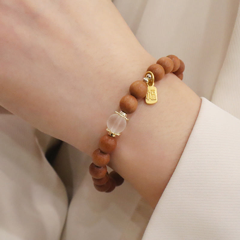 Buddha Stones Armband met bedeltje van sandelhout, kattenoog en Fu-figuur. - image 5