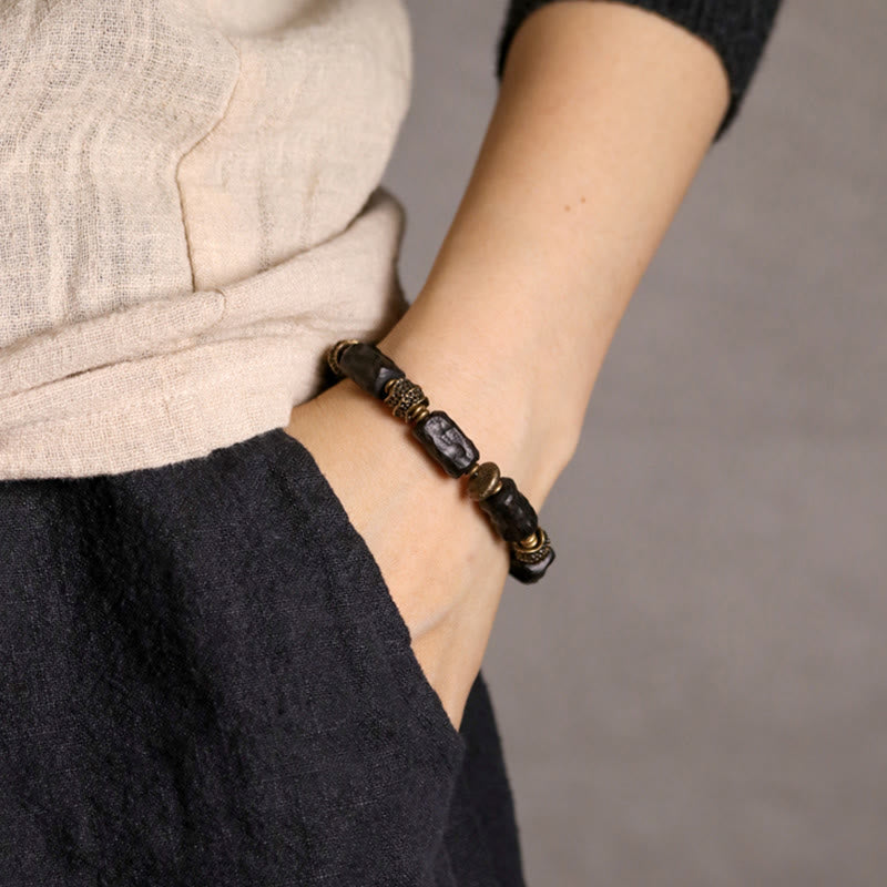 Buddha Stones Tibetaanse Armband van ebbenhout en koper, symbool voor rust en vrede. - image 1