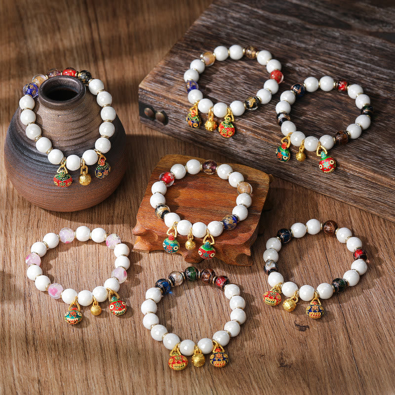 Buddha Stones Gouden geluksarmband met een afbeelding van een verslindend beest, gemaakt door Liuli Glass en kleurrijke porseleinen Armband. - image 1
