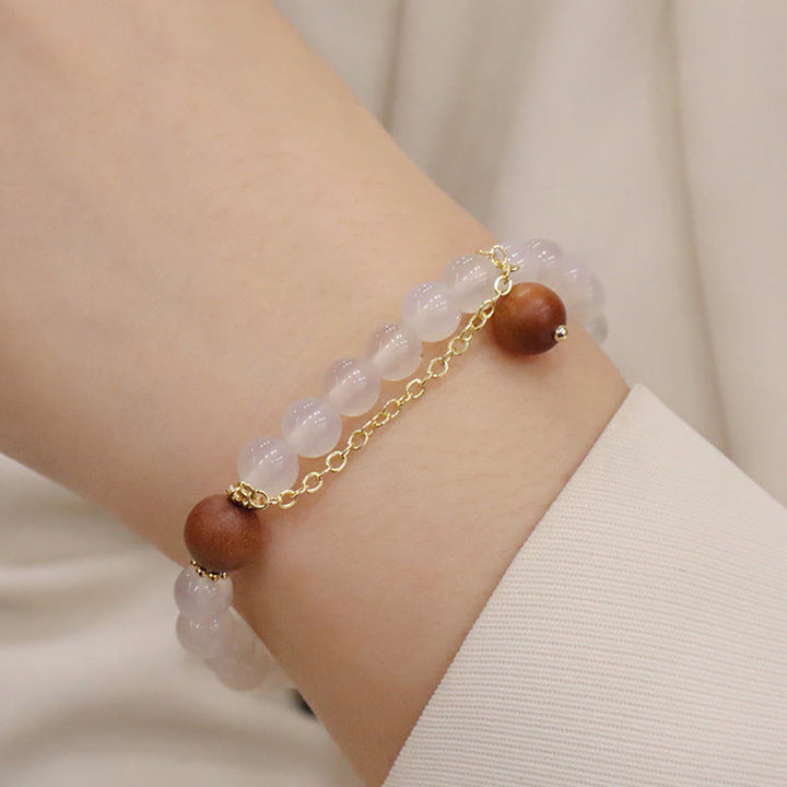 Buddha Stones Armband met bedeltje van sandelhout, kattenoog en Fu-figuur. - image 11